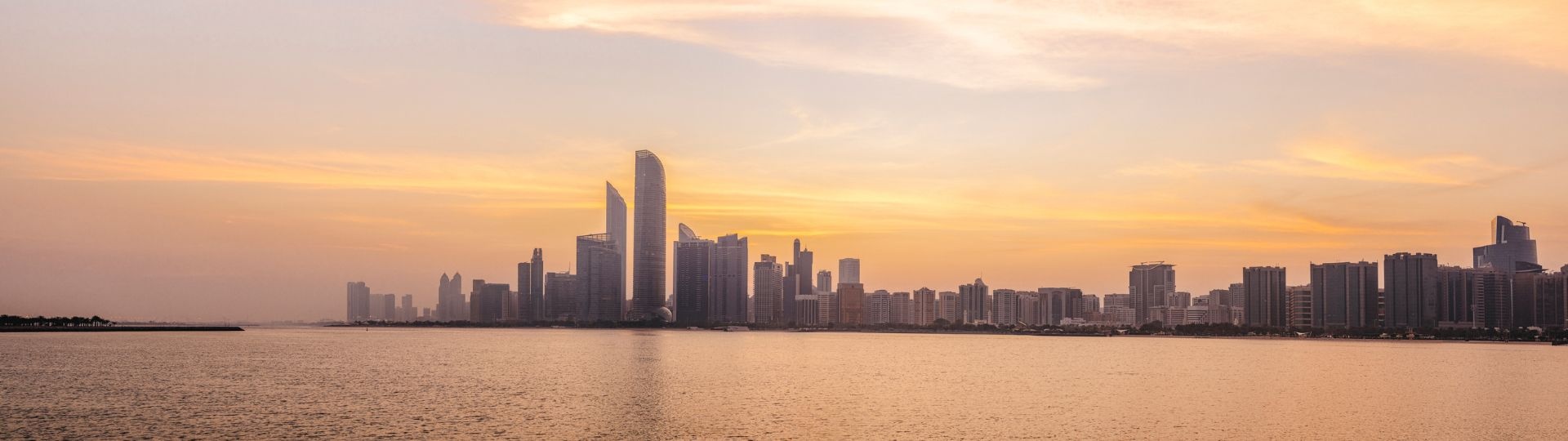 Abu-Dhabi-skyline-at-sunset